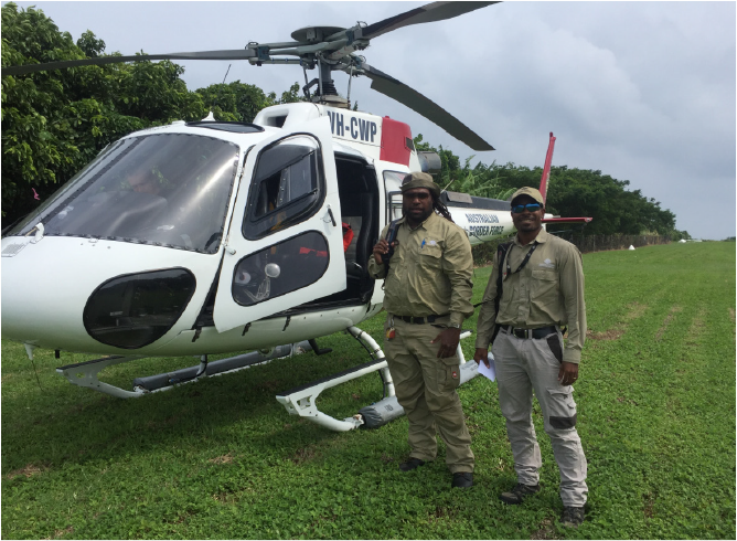 Biosecurity officers conducting fruit fly monitoring activities, using Australian Border Force helicopter