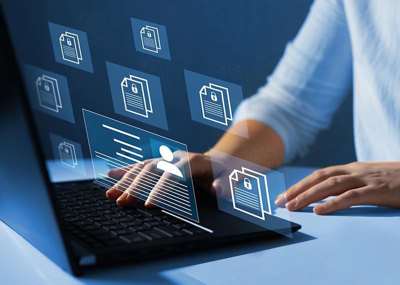 abstract image of person interacting with a laptop with overlaid file folder graphics
